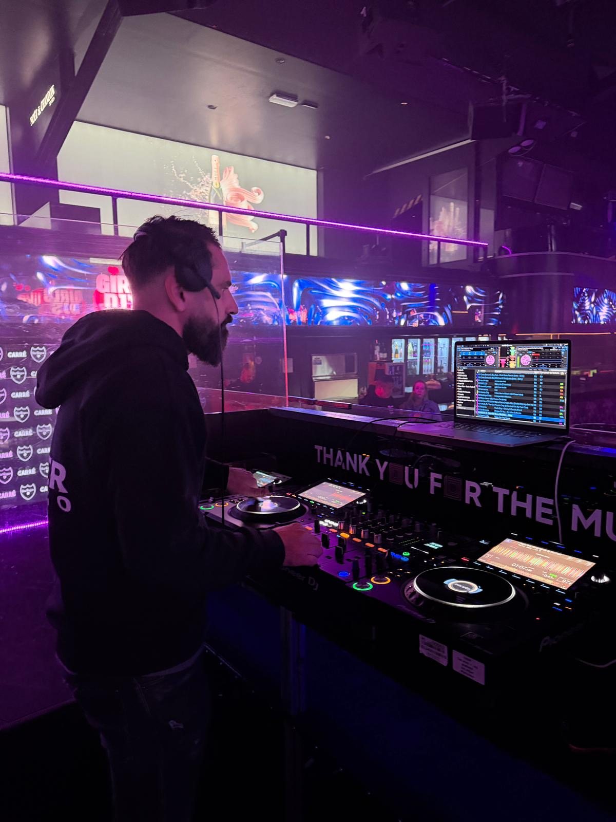 Alter Melego at Pioneer decks in a club booth